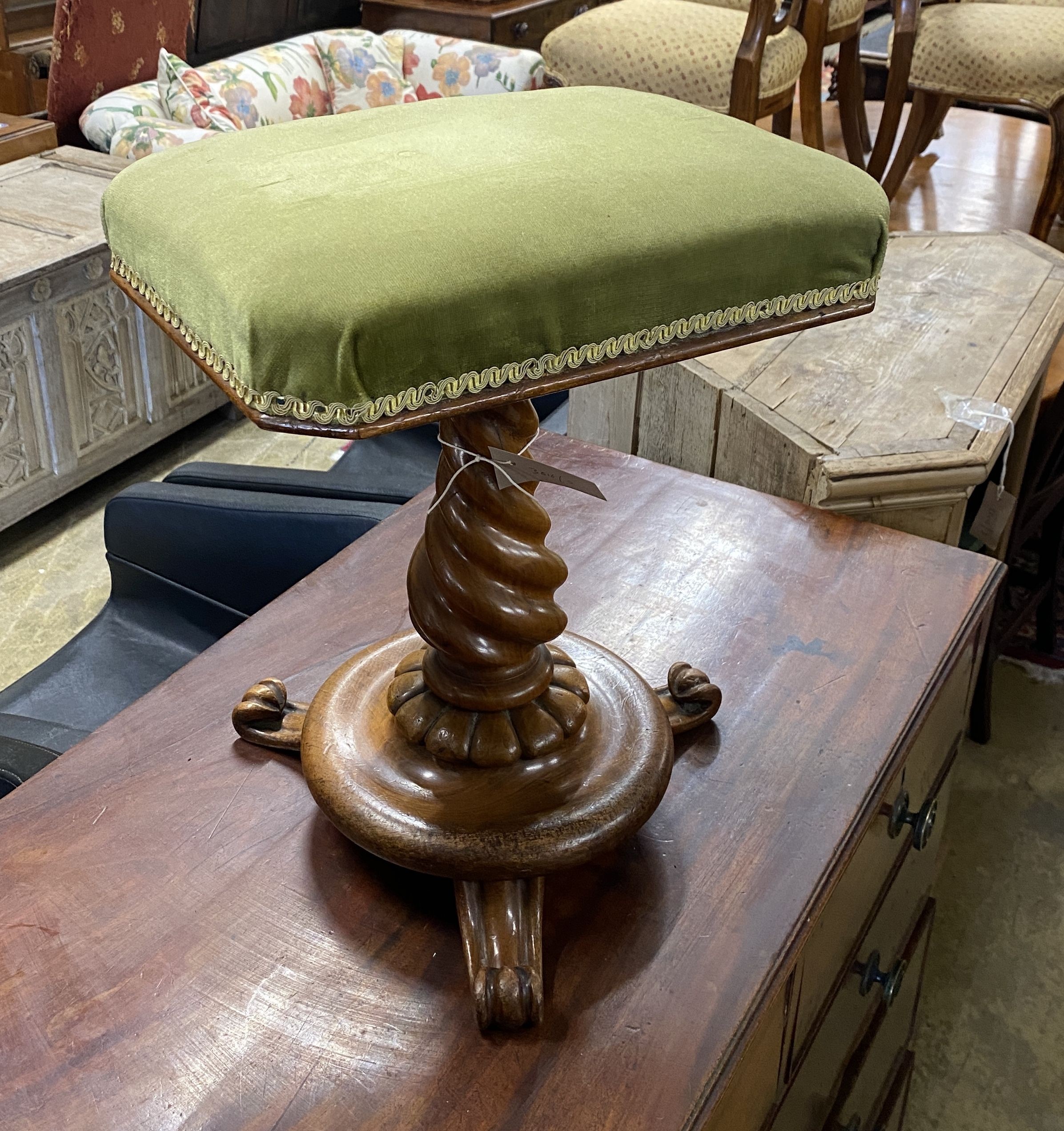 A Victorian turned walnut adjustable piano stool
